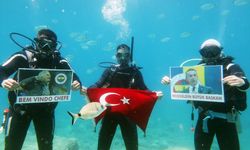 Fethiye'deki dalgıçlar, Ali Koç'un yeniden başkanlığa seçilmesini su altında kutladı