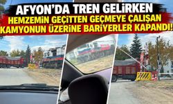 Afyon’da tren gelirken hemzemin geçitten geçmeye çalışan kamyonun üzerine bariyerler kapandı!