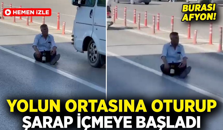 Afyon’da görenler gözlerine inanamadı: Yolun ortasına oturup şarap içmeye başladı
