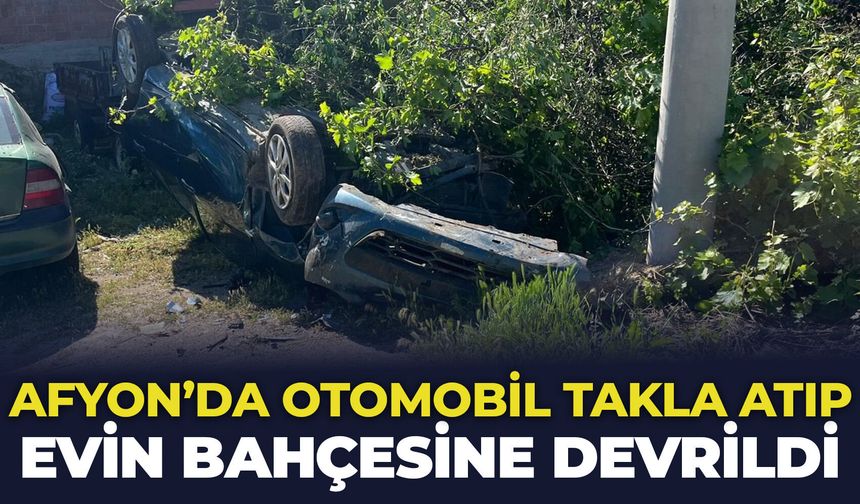 Afyon'da otomobil takla atıp evin bahçesine devrildi